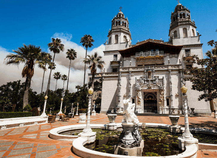White building with fountain in front, Hearst Castle California tours